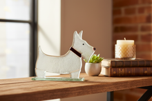 Load image into Gallery viewer, Fused glass Westie Dog art piece — a unique handmade gift, beautifully styled in a warm living room setting